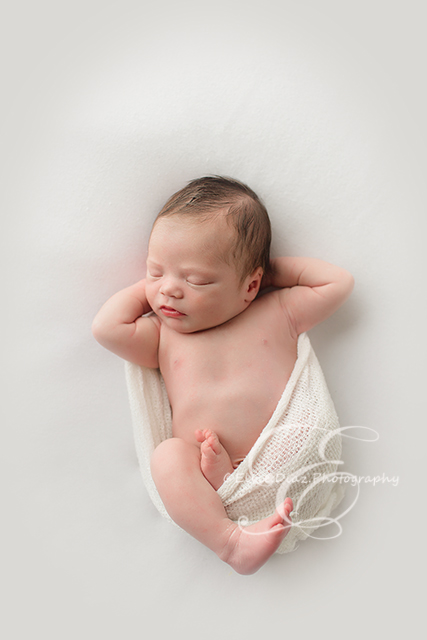 Chicago-Newborn-Photographer-Elvie-boy-pose-white-simple