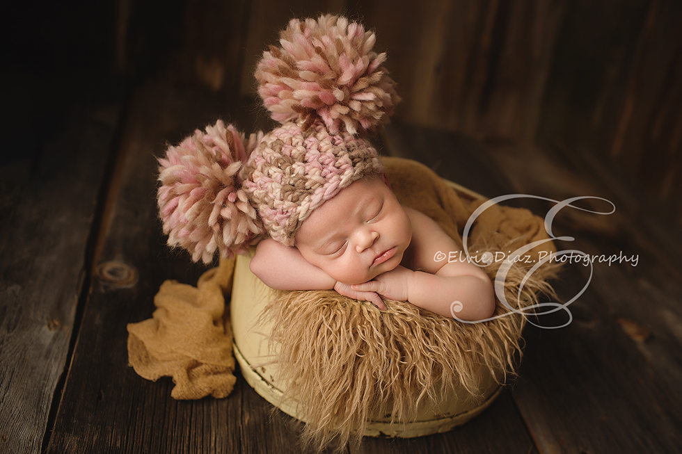 Chicago-Newborn-Photographer-Elvie-girl-fur-wrapped-bucket-pompom